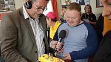 Birthday boy Robert is surprised with a cake on his big day