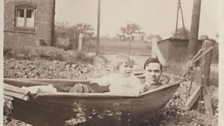 Melanie Sims | Doreen with Grandpa in hammock