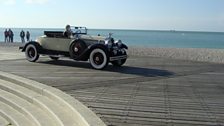 Tessa takes a Leonard Plugge-style trip down the promenade at Fécamp in a 1928 Packard Roadster