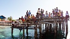 The Raja Ampat archipelago consists of thousands of islands, where local children quickly learn to swim among the coral reefs