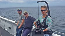 Camerawoman Sue Gibson resembles the bionic woman with her stabilizing rig, as producer Vanessa Coates looks on