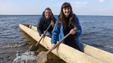 Hannah (director) and Nia (researcher) testing out a stone age fishing vessel