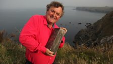 Mark holds some of the precious cargo recently recovered from the torpedoed SS Gairsoppa