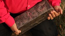 Mark holds some of the precious cargo recently recovered from the torpedoed SS Gairsoppa