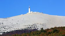 Cyclists leave the shade and protection of the wooded incline to be faced with imposing and lung busting assent to the summit