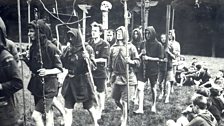 Image 5  - Kibbo Kift Kindred, men and boys on camp parade with totems, 1925