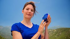 Helen holds a lump of blue lapis lazuli in the hills of Southern California