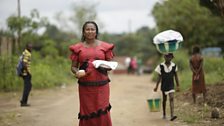 Pastor Santa delivers a meal to a neighbour