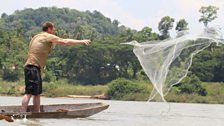 Dan balances on a precarious boat