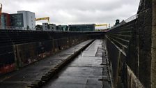 The huge dry dock. If you look closely you can see a tiny human size cut out