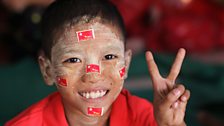 Boy at election rally for Aung San Suu Kyi's NLD near Yangon