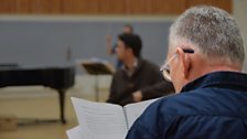 Director James Robert Carson watches rehearsal