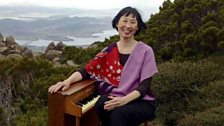 A toy pianist on a hillside