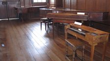 Historic keyboards in the hall at Finchcocks Musical Museum