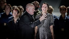 The friar Melitone (Andrew Shore) threatens a member of the English National Opera Chorus in Verdi's Forza del Destino