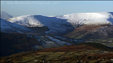 A delicate dusting of snow on the mountains