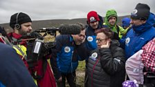 Jo and the team huddle round as she is interviewed on ITV This Morning