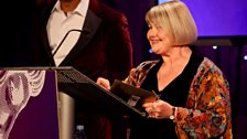 Actress, Annette Badland presents an award