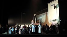 The villagers assemble after the Sunday service for the Easter parade in Mascagni's Cavalleria Rusticana