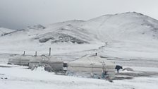 Mongolian Ger or yurt encampment for herders in the snow