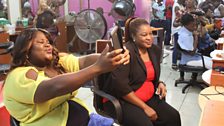 Tracy, 19, and her mother Hope, at Cool-Time Beauty Salon in the Randburg district of Johannesburg, South Africa.