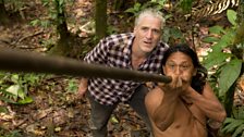 Waorani chief, Penti, shows Gordon how they hunt with 3m long blowpipes and poison darts