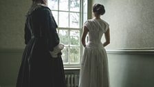 Charlotte Bronte, played by Sophie Trott looks out the window