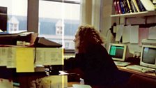 Reporter Jackie Hardgrave at work in the 1990s with just one computer switched on in the corner
