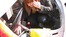 As the doors on the car were welded and bolted shut, she had to clamber in through where the windscreen once was!