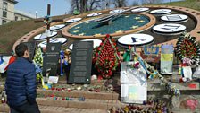 Flower tributes to those killed on Heavenly Hundred Heroes Avenue