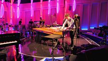 Tom Pritchard sets up his gear for the Percussion camera rehearsal