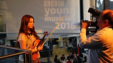 Violinist Louisa Staples preparing for her close up