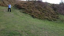 Helen Mark scaling the ramparts of Old Oswestry Hillfort