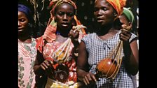 Villagers taking part in a welcoming ceremony for the Zoo Quest team