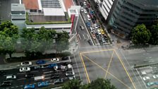 Cars at a Singapore traffic crossing