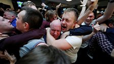 Fans watch the victory