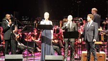 Our singers on stage with conductor Mike Dixon and the brilliant 鶹ҳ Concert Orchestra