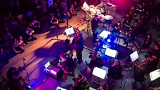 Joby Burgess, conductor Gerry Cornelius, trumpeter Daniel de Gruchy-Lambert and Mr Switch perform with the Southbank Sinfonia