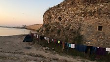 Refugee clothes drying alongside Chios’ ancient fortress