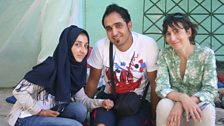 Ali and Wissam, brother and sister from Syria with Maria at the remains of their temporary home