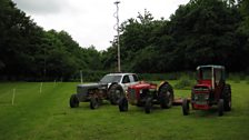 The radio car with some classic vehicles outside the church in Catfield