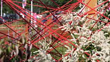 Threaded in a dramatic pattern this red rope represents the complex journey destiny can take to connect two people.