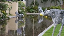 Lively sculptures capture the character of dogs, whilst the stillness of the large water feature represents abandonment.