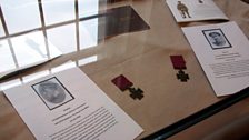 Victoria crosses on display at Parliament Buildings