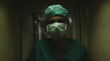 A nurse prepares for theatre on the Lifeline Express