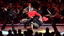 Karen Clifton and the male dancers dance at the Strictly Prom with conductor Gavin Sutherland and the 鶹ҳ Concert Orchestra