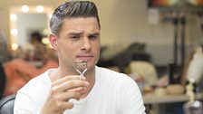 Aljaz eyes up the eyelash curler