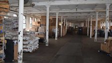 Inside the old Singer factory, now a warehouse for imported Chinese goods