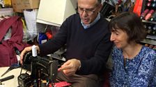 Tony Kiteos and Maria in his shop inspecting her machine