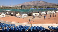 The old baseball stadium from the 2004 Athens Olympics, now used to house refugees as part of the Elliniko camp